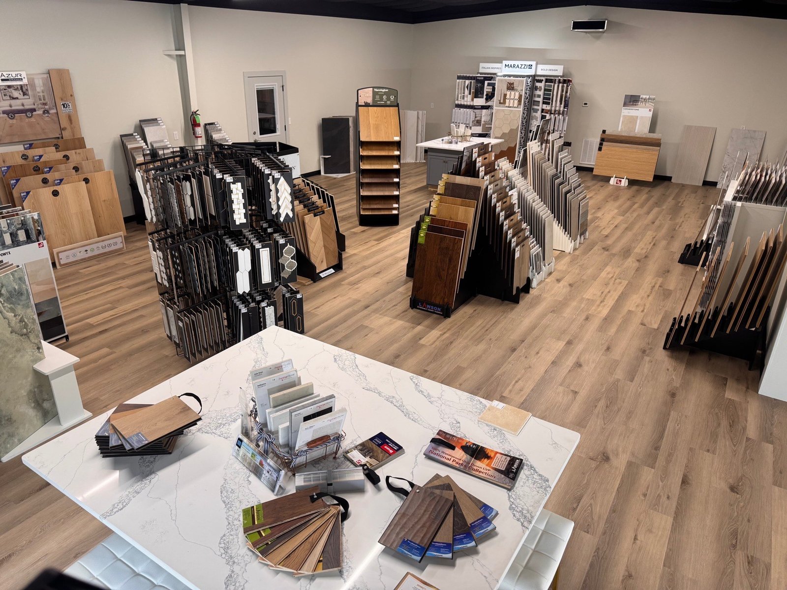 Luxe Flooring & Stone showroom interior with hardwood and tile samples