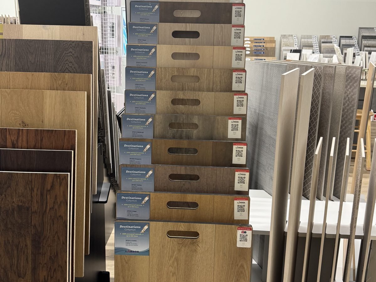 Laminate flooring planks displayed at Luxe Flooring & Stone