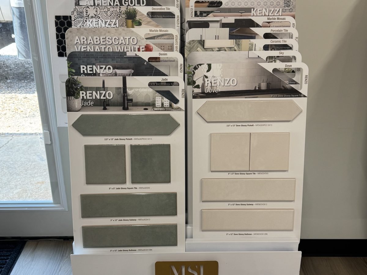 Marble mosaic sheets shown for backsplash and shower accents